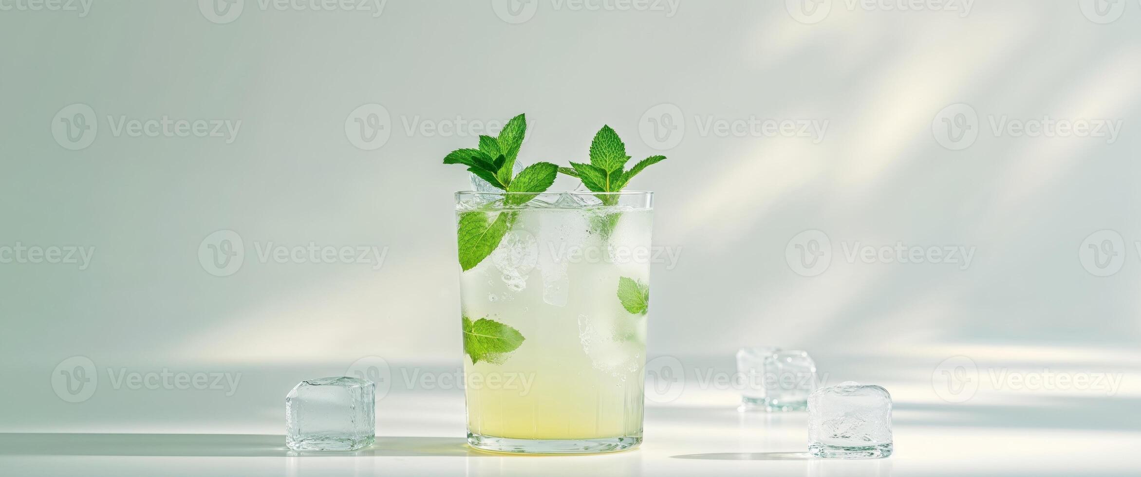 Refreshing Lemonade Drink With Mint And Ice Cubes. photo
