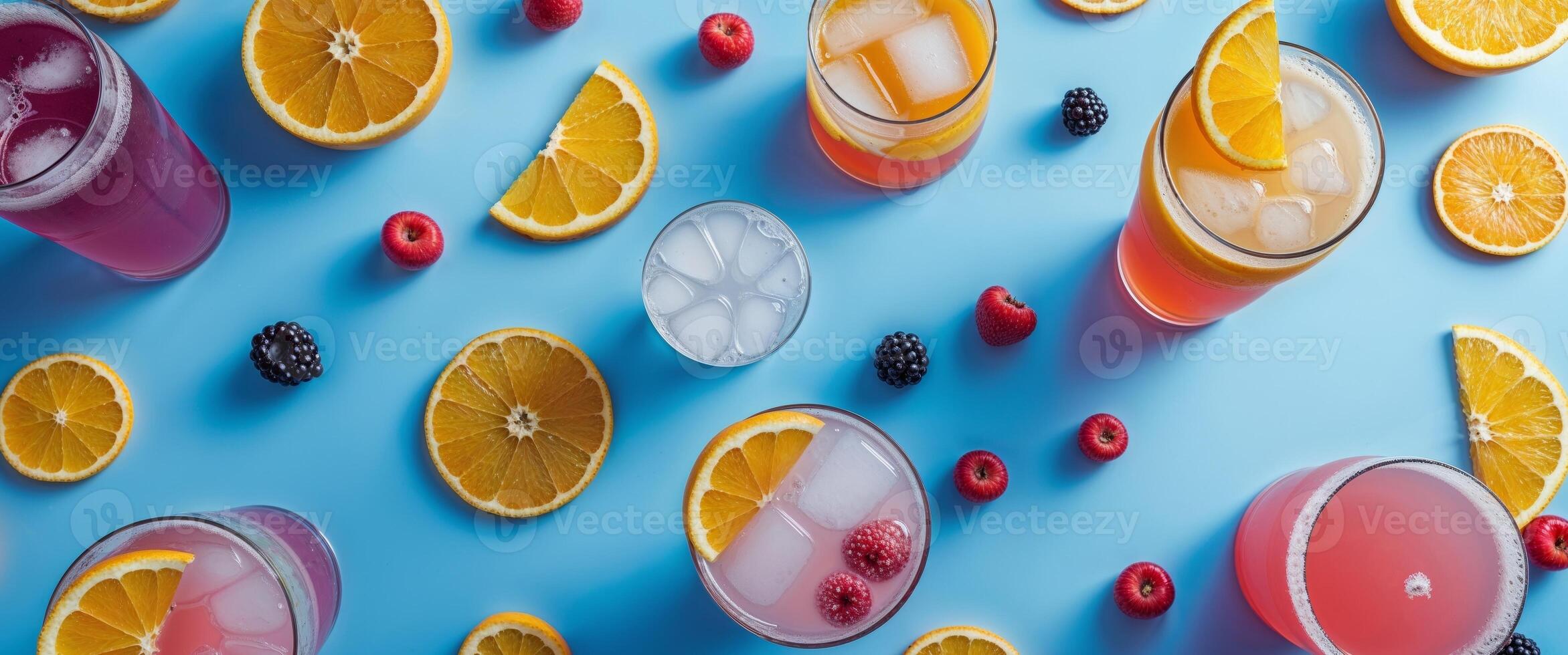 A variety of colorful drinks are arranged on a blue background photo