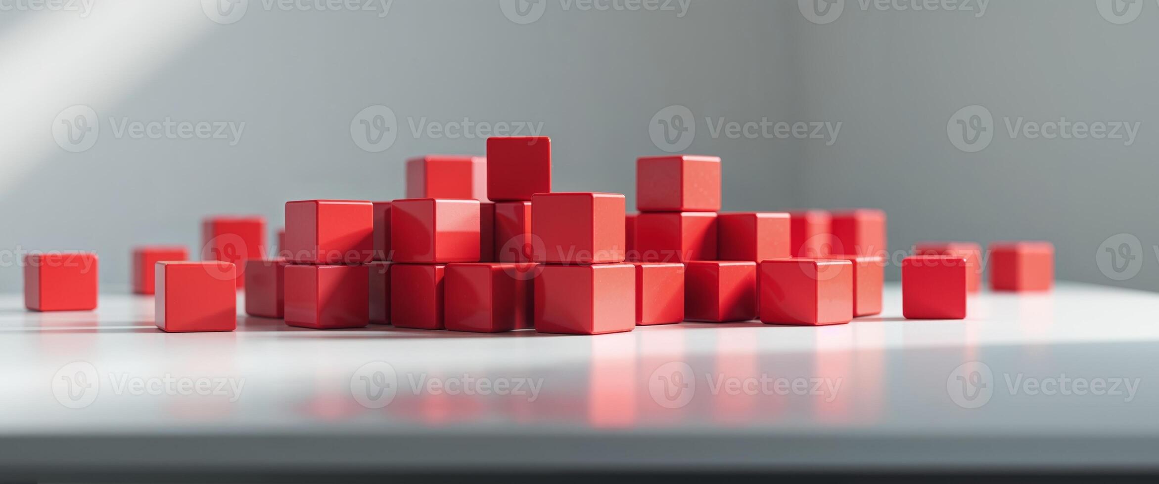 A pile of red cubes on a table photo