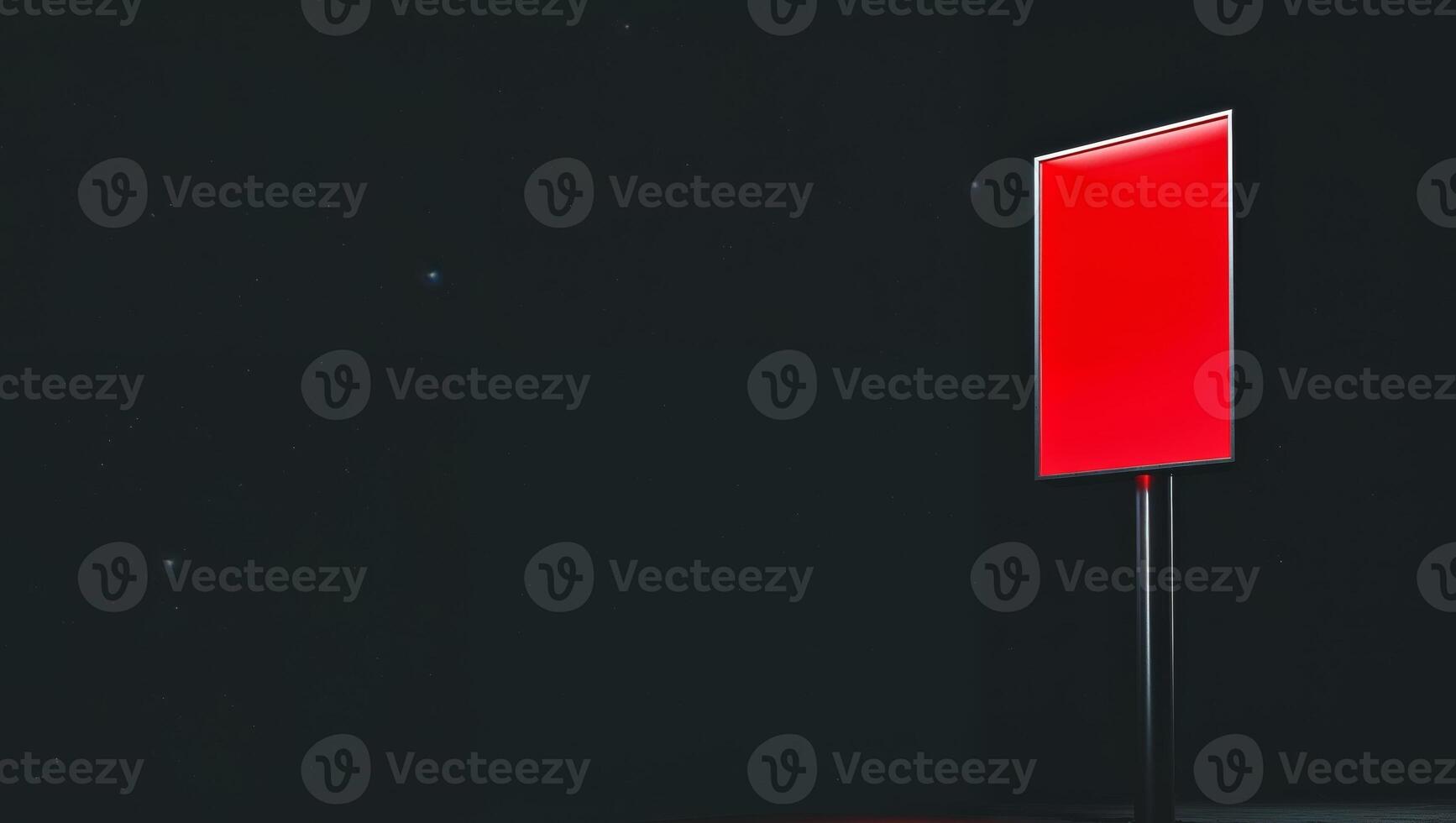 there is a red sign on a metal pole in the dark. photo