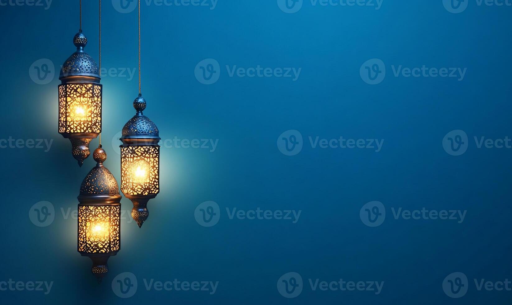 Three ornate lanterns glowing against a blue background. photo