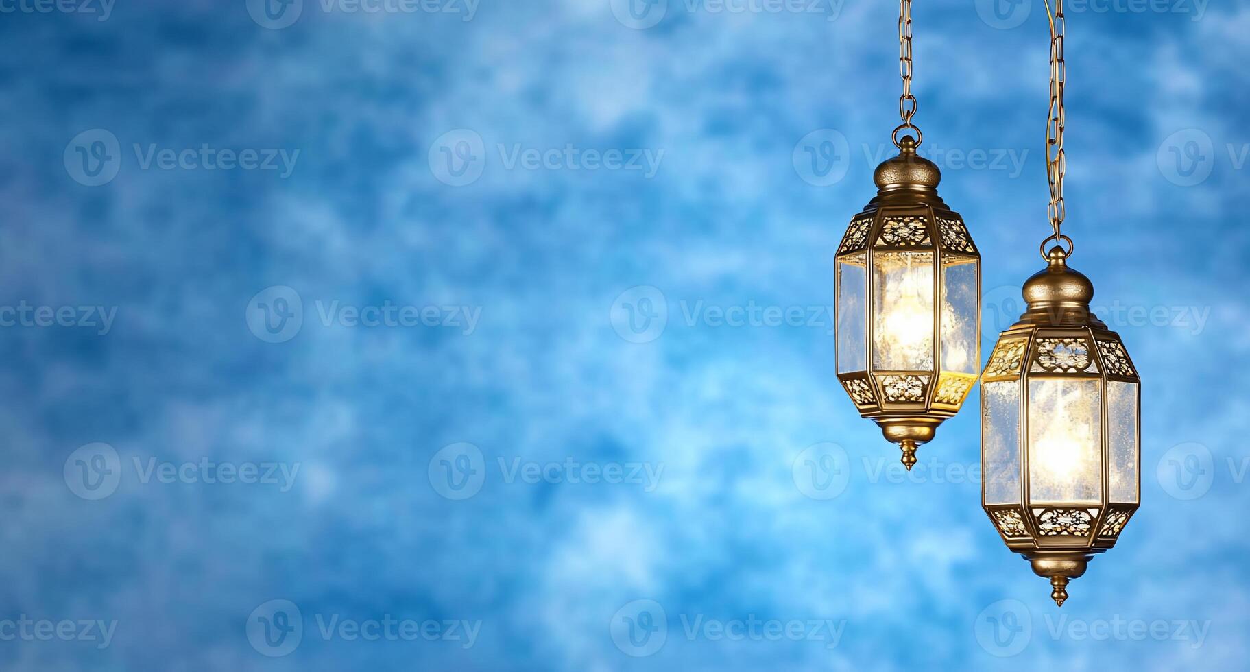 Two ornate hanging lanterns against a blue textured background. photo