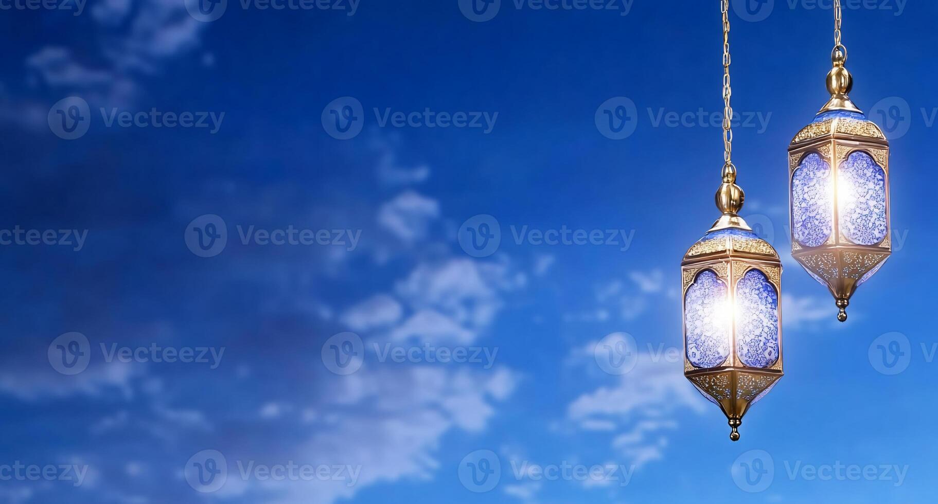 Two ornate hanging lanterns against a blue sky with clouds. photo