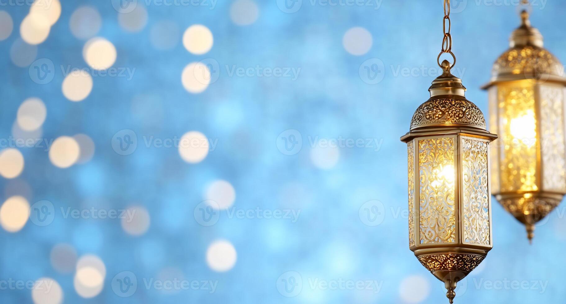 Elegant lanterns glow against a soft, blurred blue background. photo