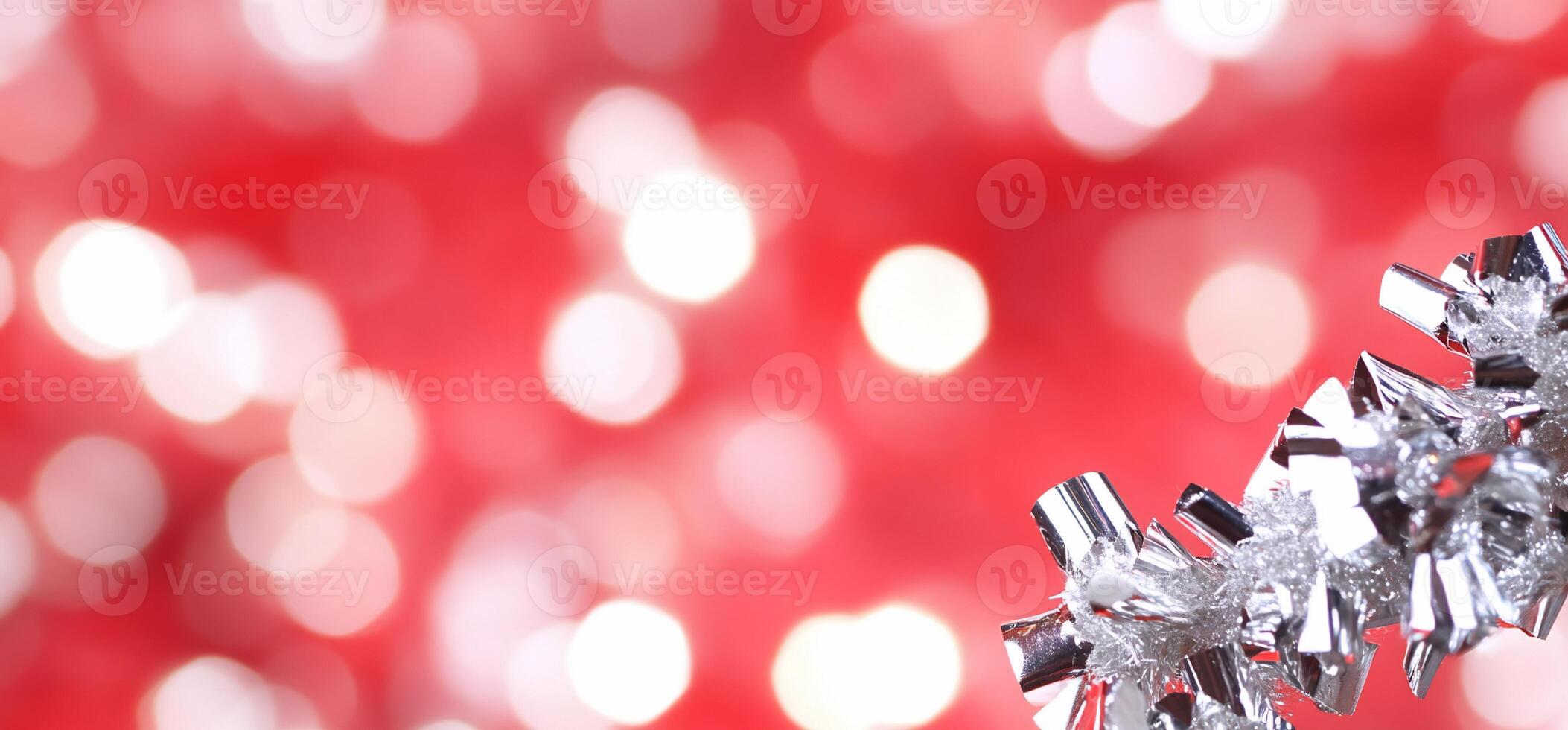 A festive background with shimmering silver decor against a red backdrop. photo