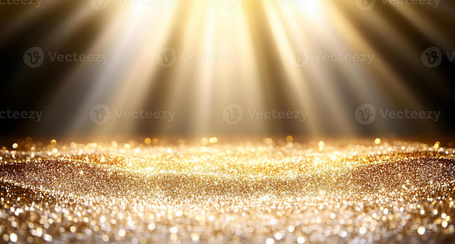A shimmering golden surface illuminated by radiant beams of light. photo