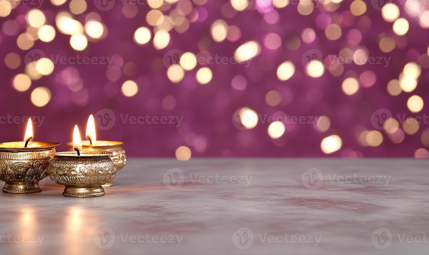 Three lit oil lamps on a surface with a blurred bokeh background. photo