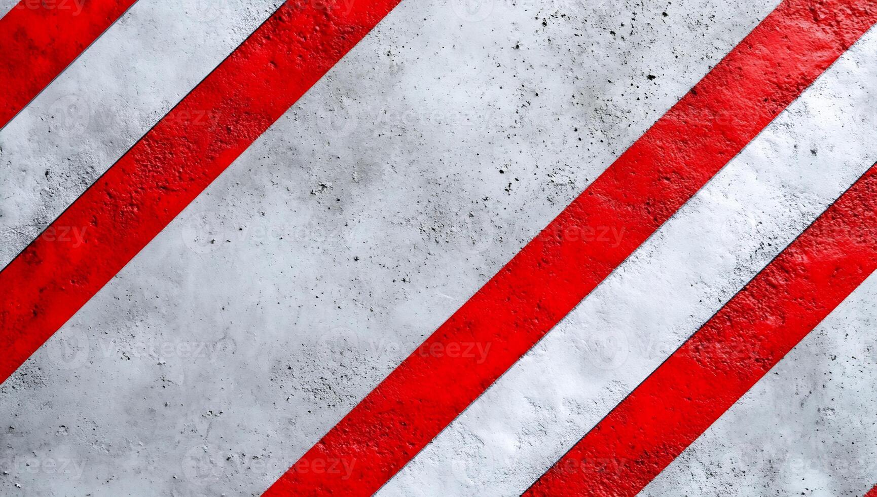 A red and white striped background with a warning sign photo