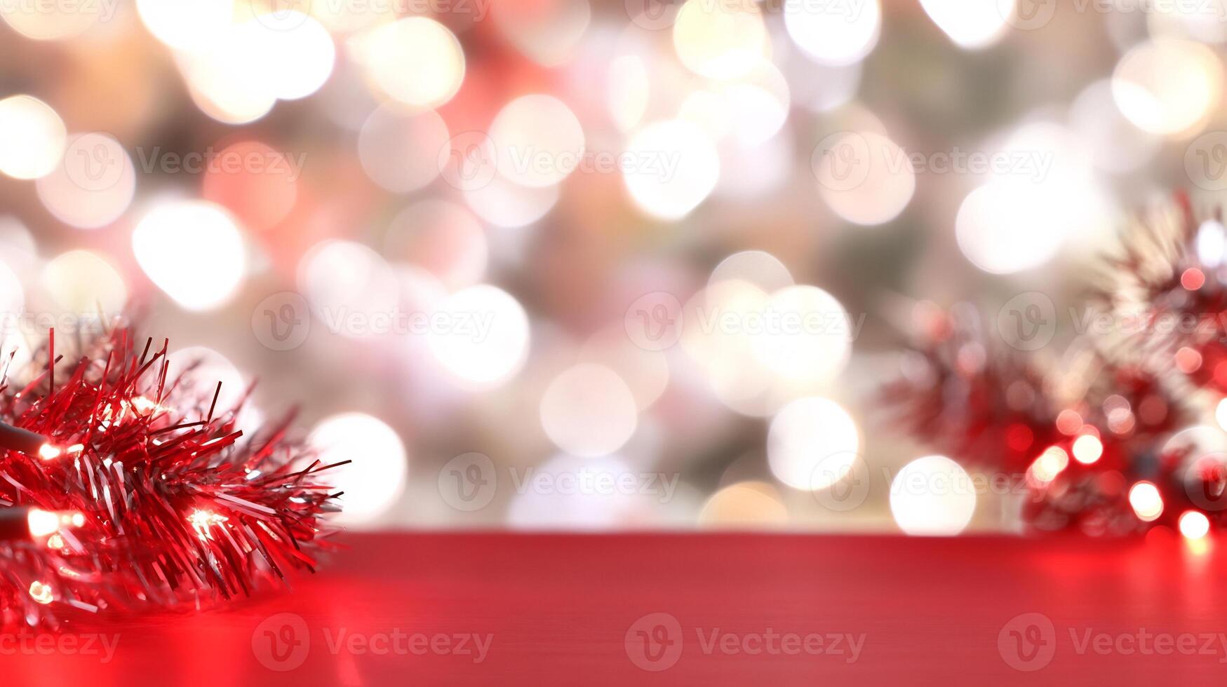 Festive red lights on table, bokeh background. Holiday greeting card, product display photo