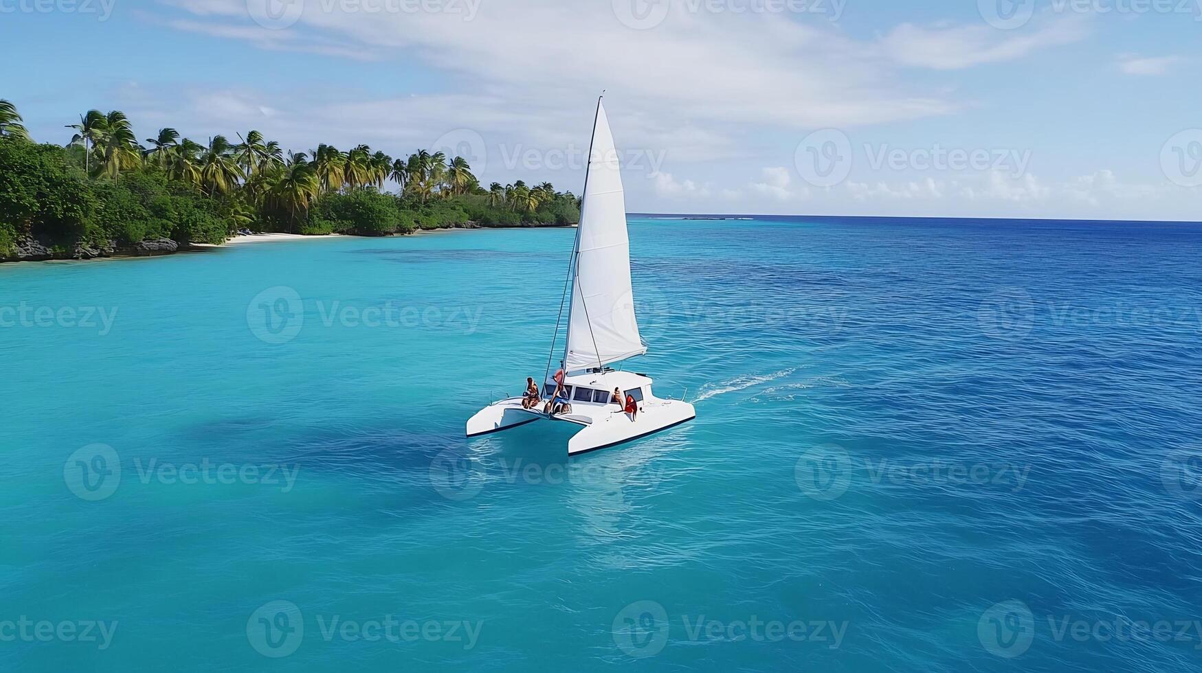 A catamaran sailing in the ocean near a beach photo