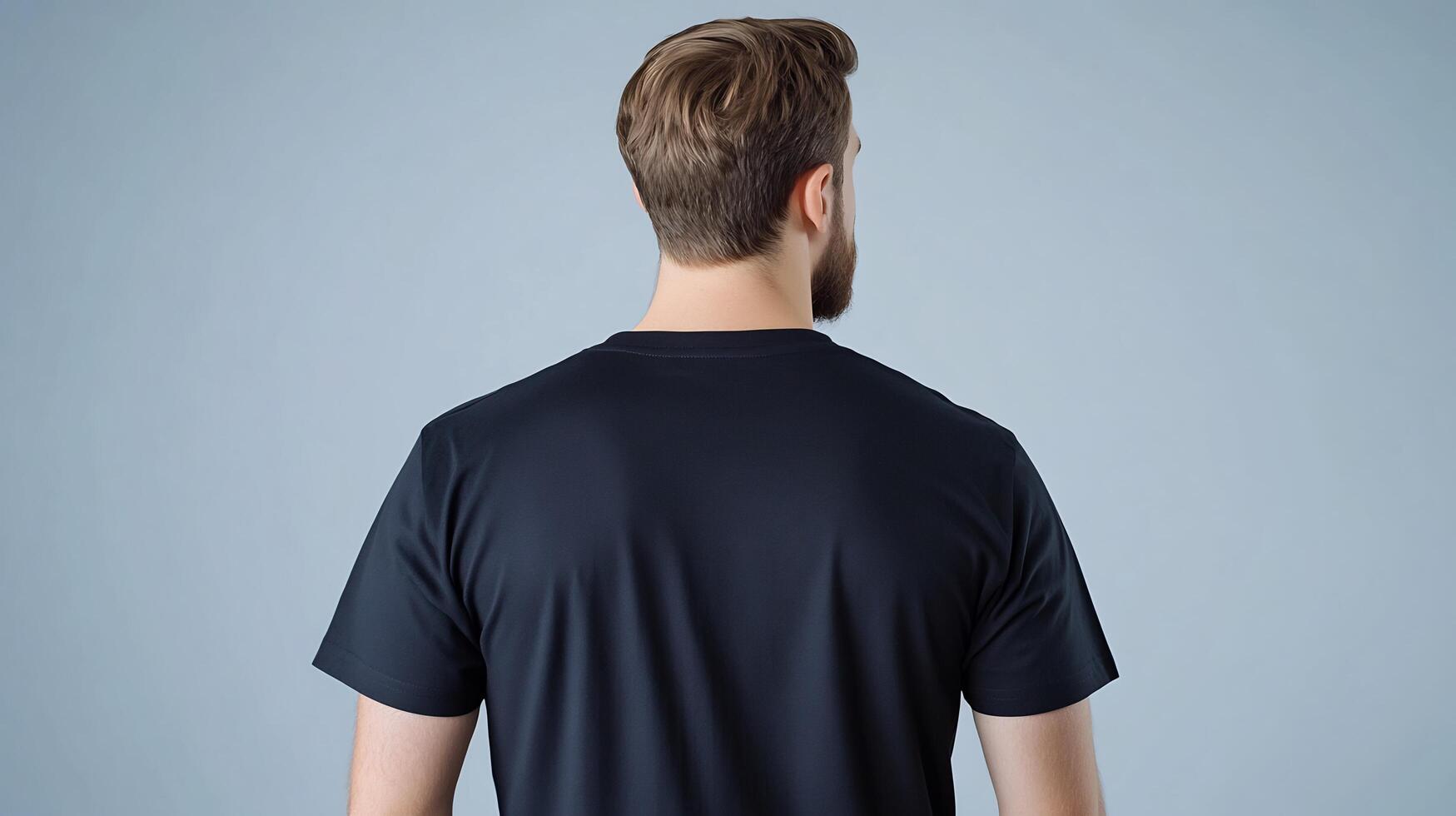 Back view of a man in a black t - shirt mockup photo