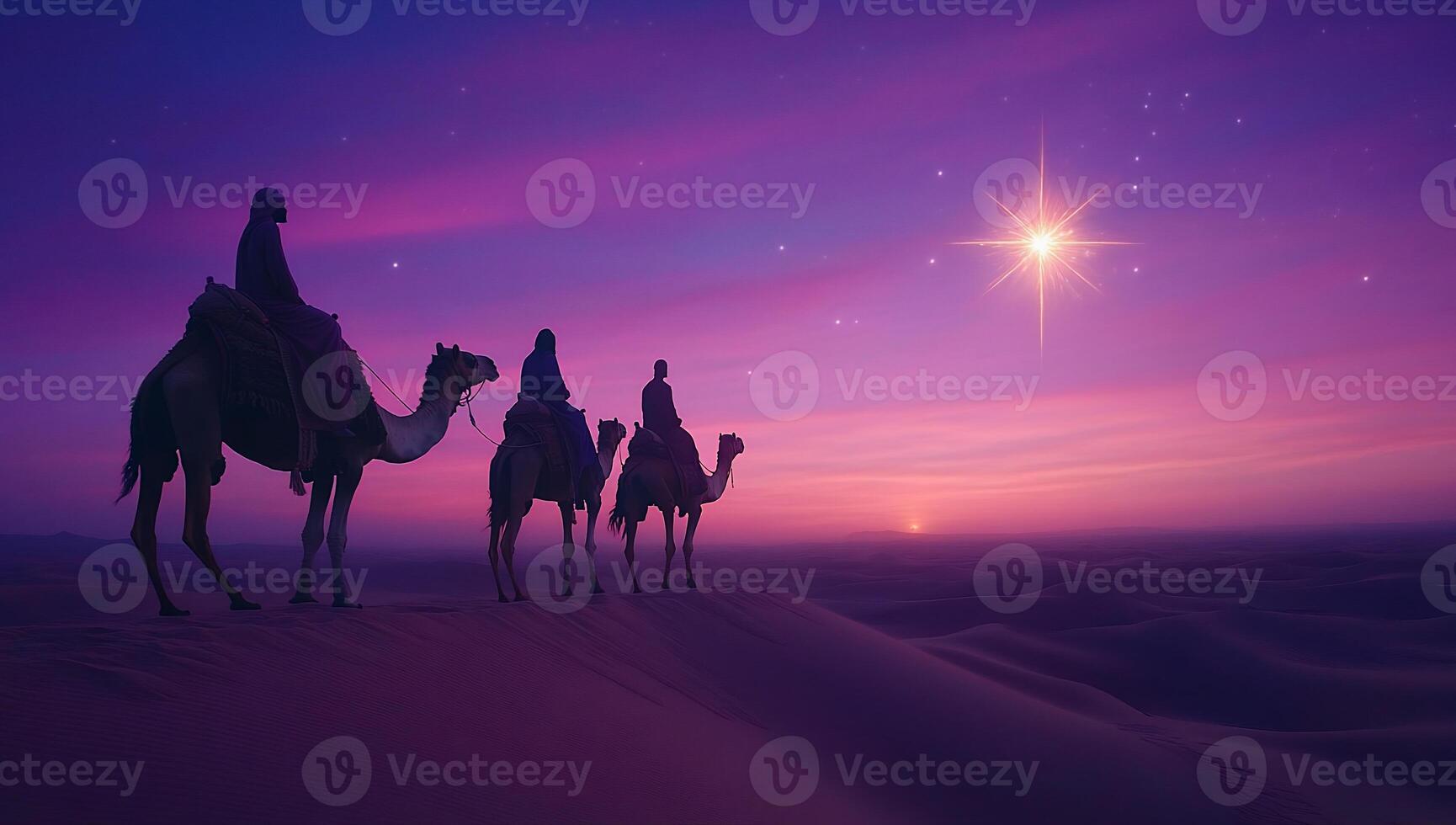 Camels and riders silhouetted against a colorful desert sunset. photo