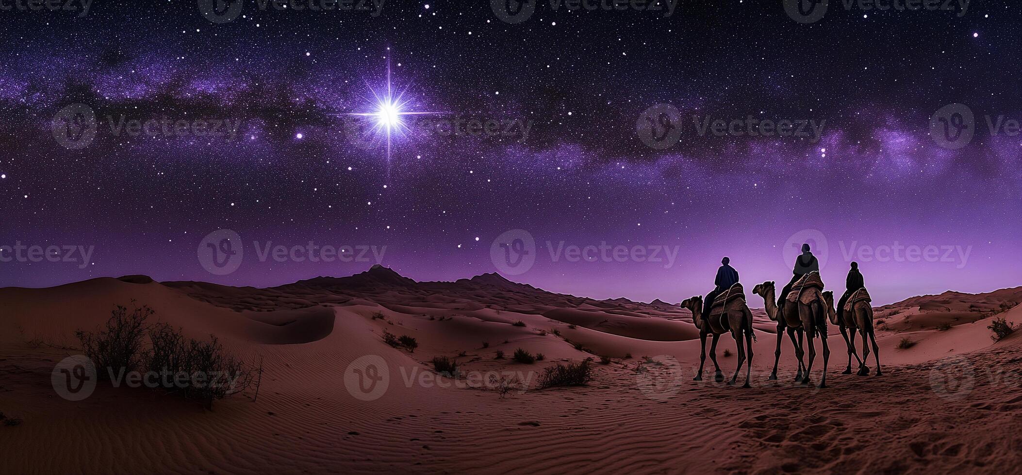 Camels traverse a desert under a starry night sky. photo