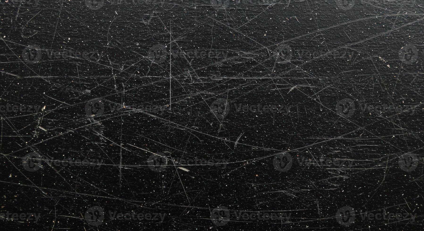 A black surface with scratches and scratches photo