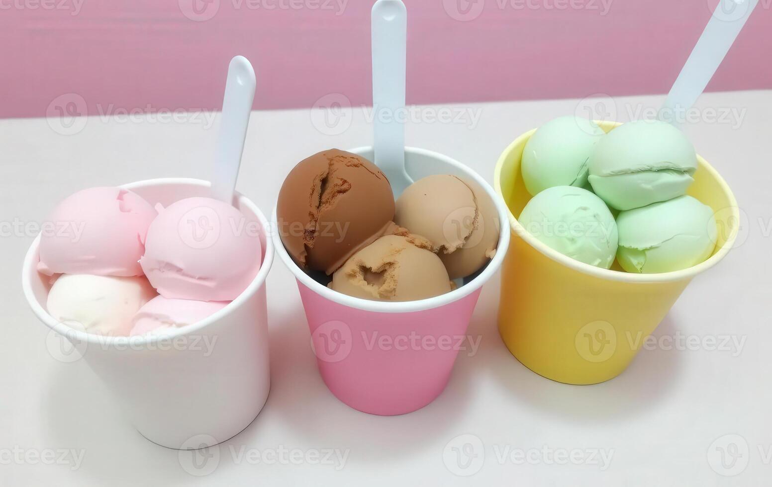 Three cups filled with ice cream and different colored eggs photo