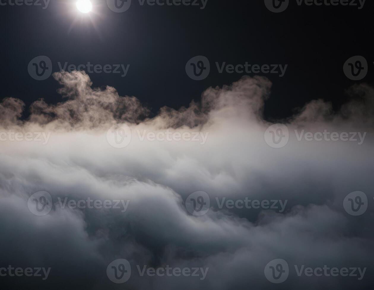 A plane flying over the clouds at night photo