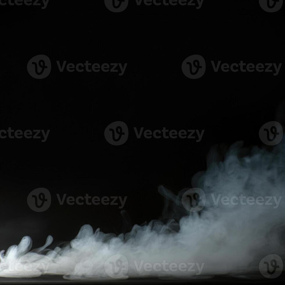 A man in a suit is standing in front of a black background photo