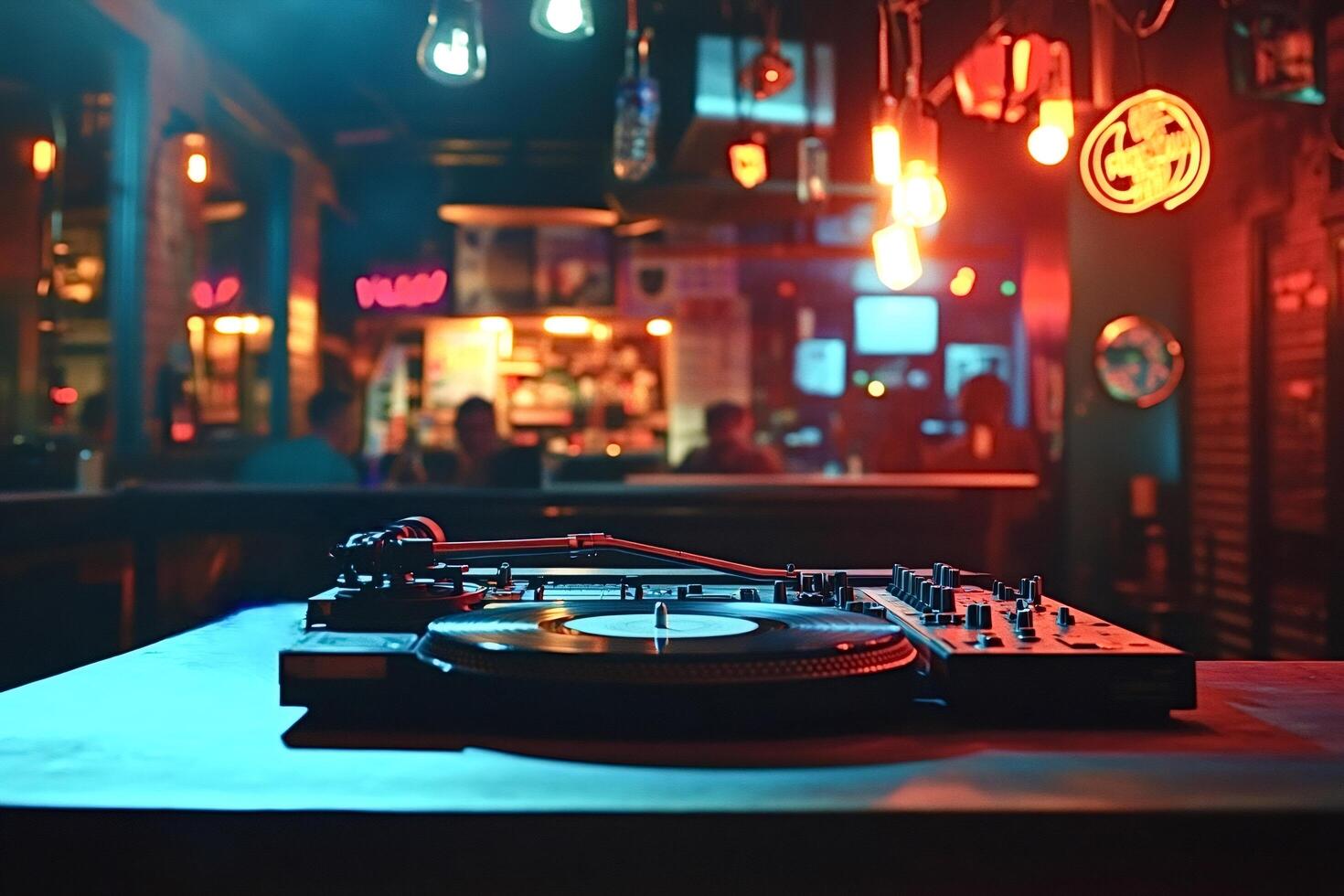 Dj set playing music in nightclub with colorful lights photo