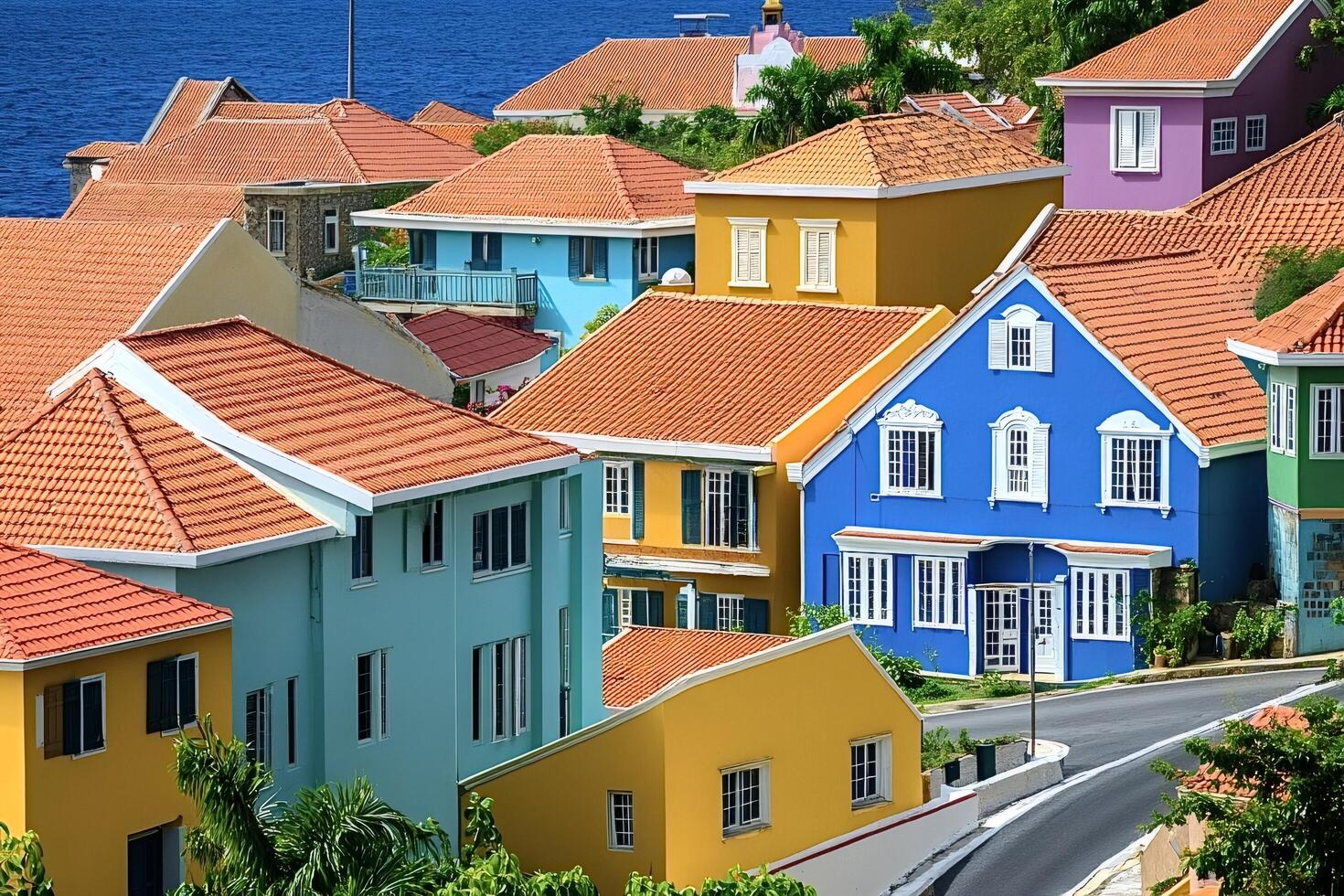 Colorful houses overlooking the caribbean sea in curacao photo