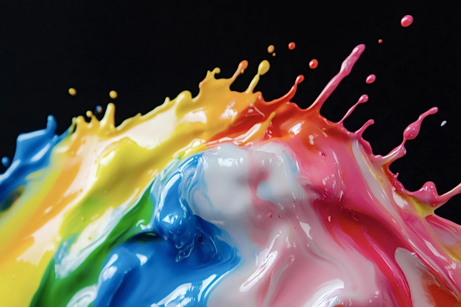 Colorful paint splashing on black background photo