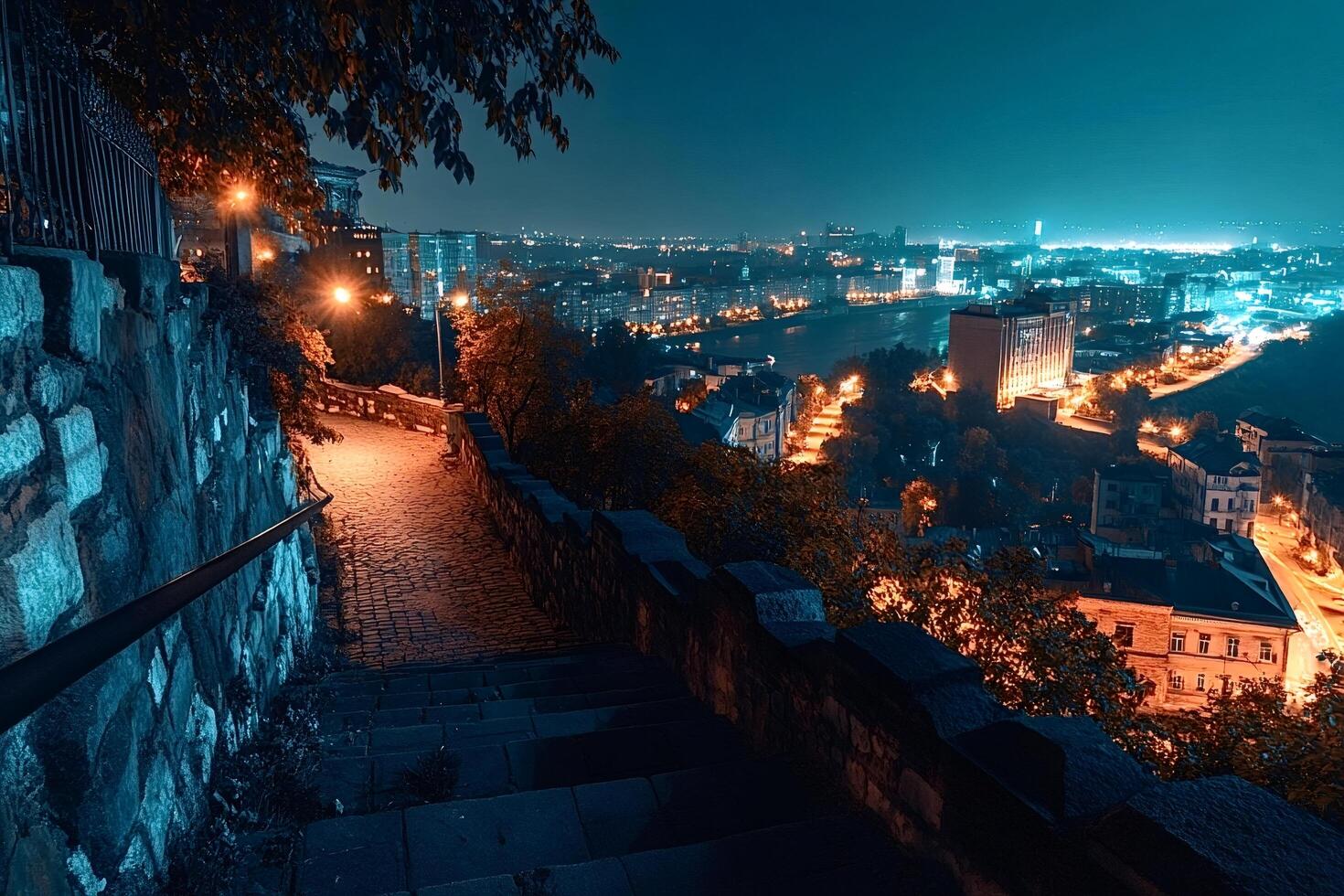 Cobblestone stairway descending into the illuminated cityscape of podil, kyiv photo