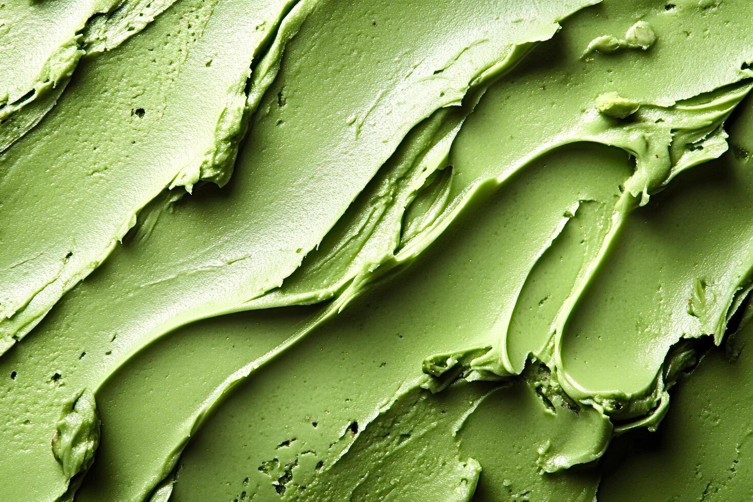Matcha cream cheese frosting swirls creating a textured background photo