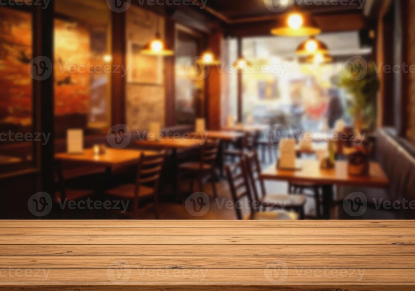 Wooden table top in restaurant with blurred background photo