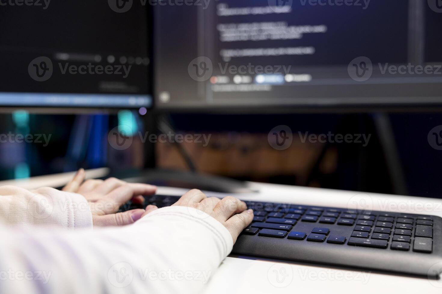 Freelancing system administrator futureproofing company network from downtimes and unexpected system failures. Close up shot of tech support admin typing on keyboard, increasing data security photo
