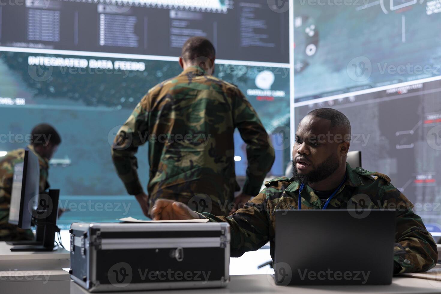 Military expert studies old classified documents in a control tower power base, gathering intelligence from satellite systems and past missions. Process critical information and strategic planning. photo