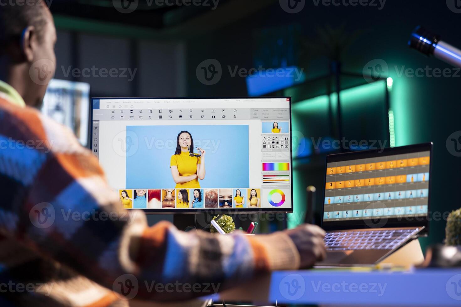 Professional graphic designer retouching images on dual monitors in a creative office environment, demonstrating multitasking skills and innovative techniques. Well organized editor. photo