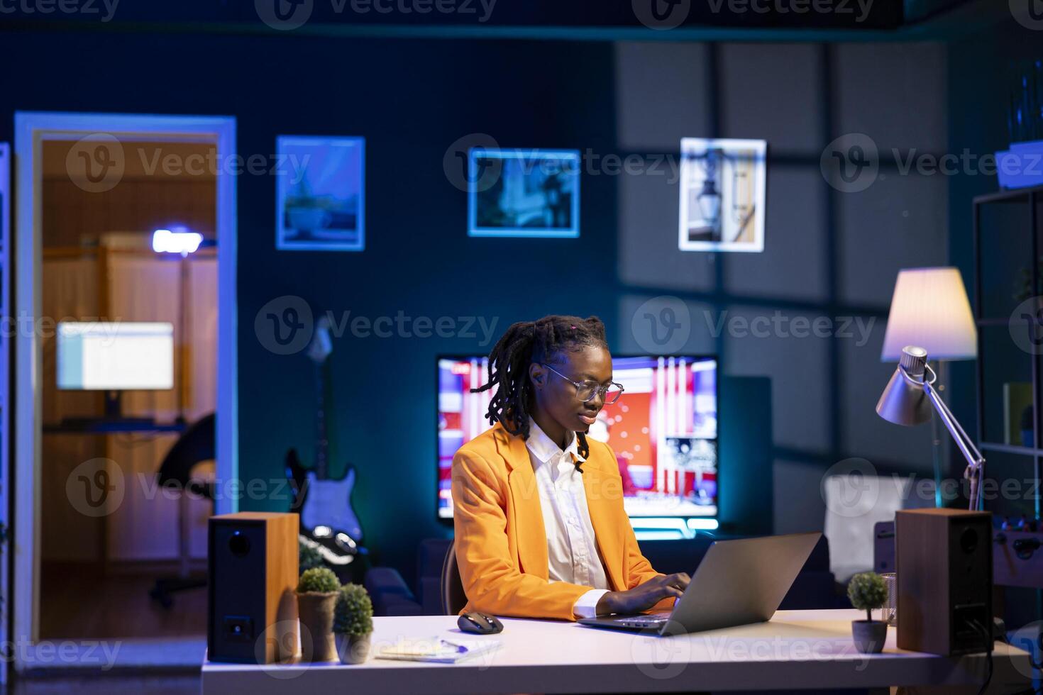 Worker analyzing data charts on laptop at desk, interpreting statistical graphs, identifying trends, compiling analytical reports, using data analysis software to process and visualize information photo