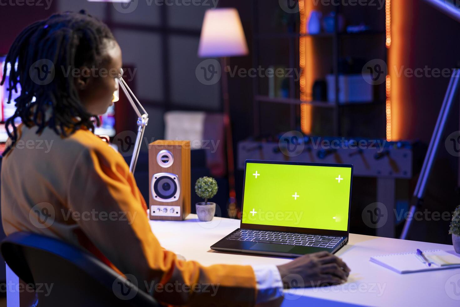 Teleworker in apartment office using mockup laptop to analyze sales report and plan business development. Woman working from home doing project research, typing on isolated screen notebook photo
