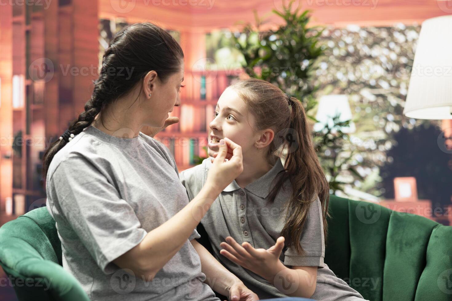 In therapy, mother scolds her disobedient daughter over misconduct, reflecting the generational conflict, stubbornness and manipulation often seen in troubled family dynamics during puberty. photo