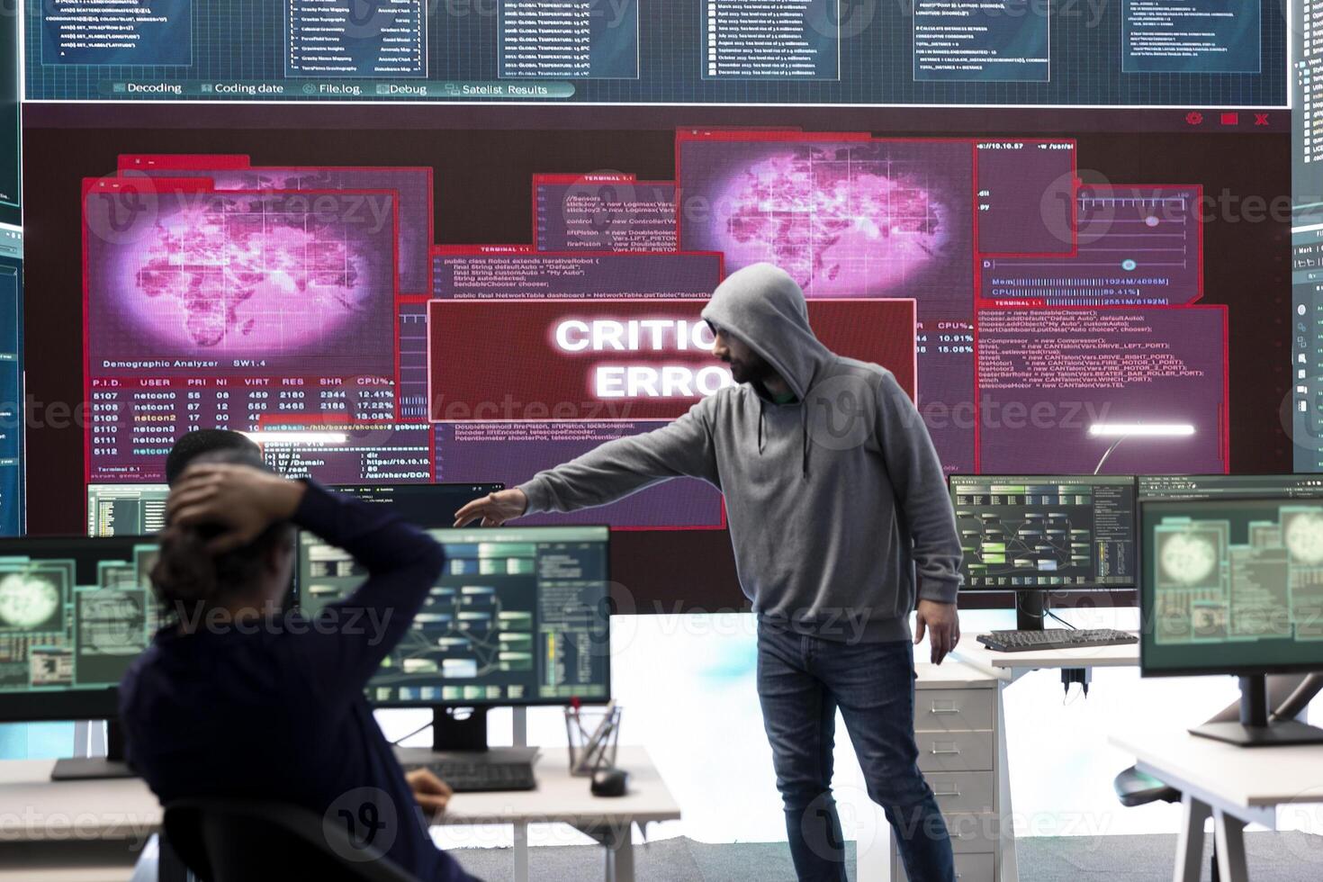 Hackers group failing to hack a system in high tech agency office, reading critical error message on big screen. Specialists trying to steal important database information from rival states. photo