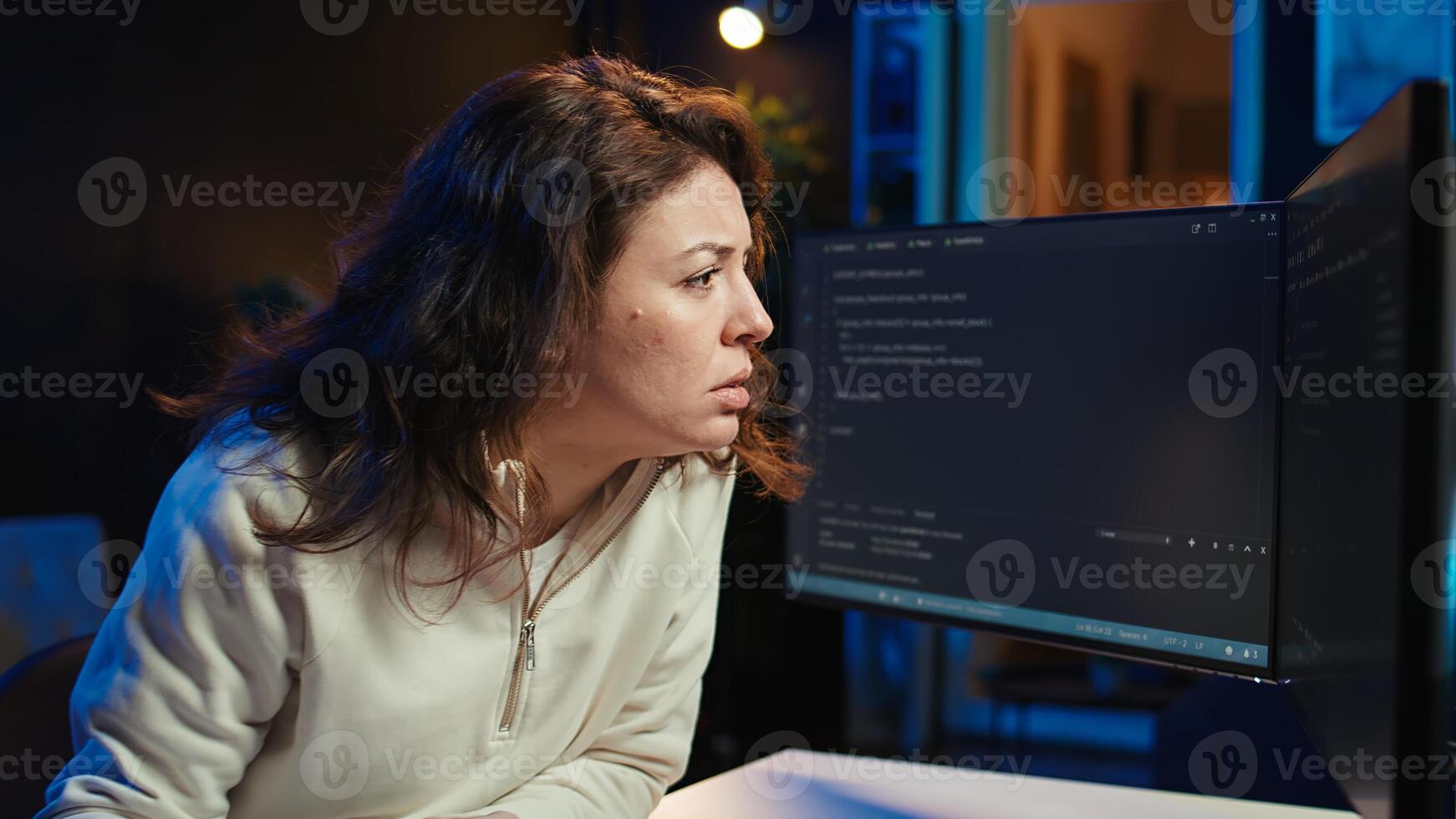 Cybersecurity specialist looking confused at computer screen while trying to fix broken code. Contemplative developer feeling worried and anxious about programming errors, camera B photo