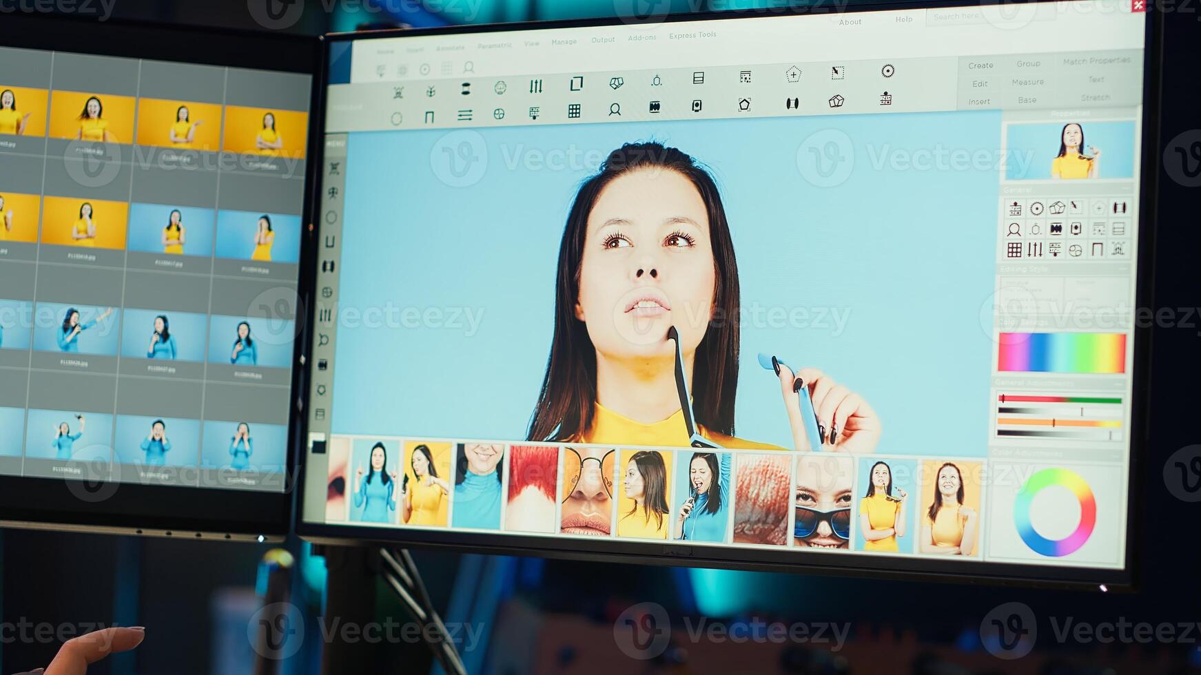 Photo editor using graphic tablet to retouch photographs with editing software on, zooming in to find spots that need correcting. Photographer in creative workplace adjusting images, camera A