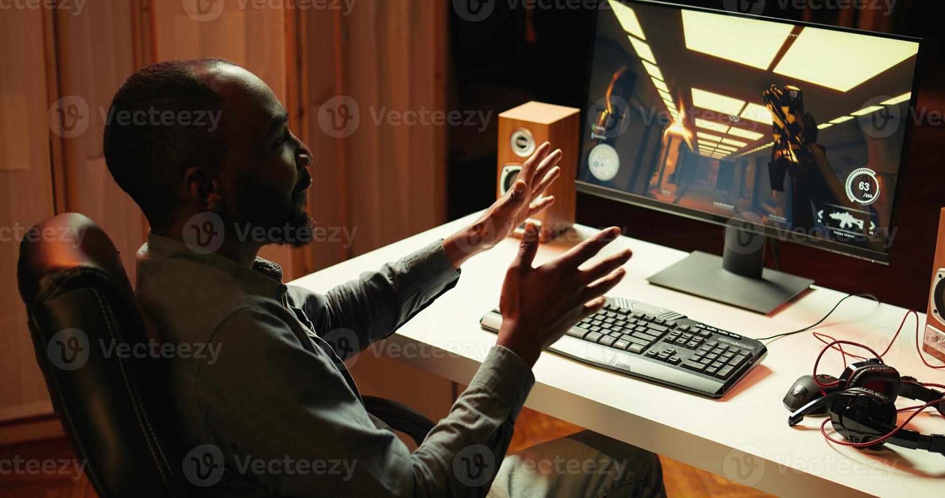 Cheerful streamer discussing with fans, showing them how to win computer game. Pro player starting stream, filming himself while playing on gaming PC, welcoming audience, camera B photo