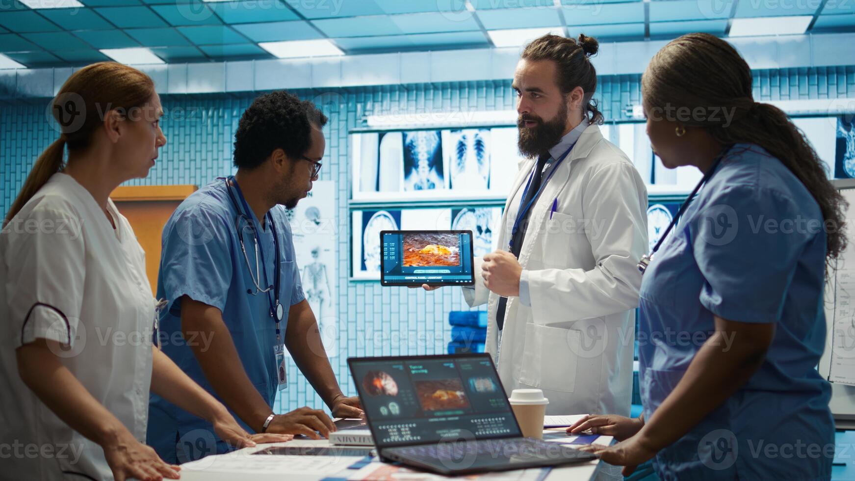 Neurology specialist examines magnetic resonance imaging brain scan with team during a meeting, looking at tomography for accurate neuroscience diagnosis. Diverse team of doctors. Camera B. photo