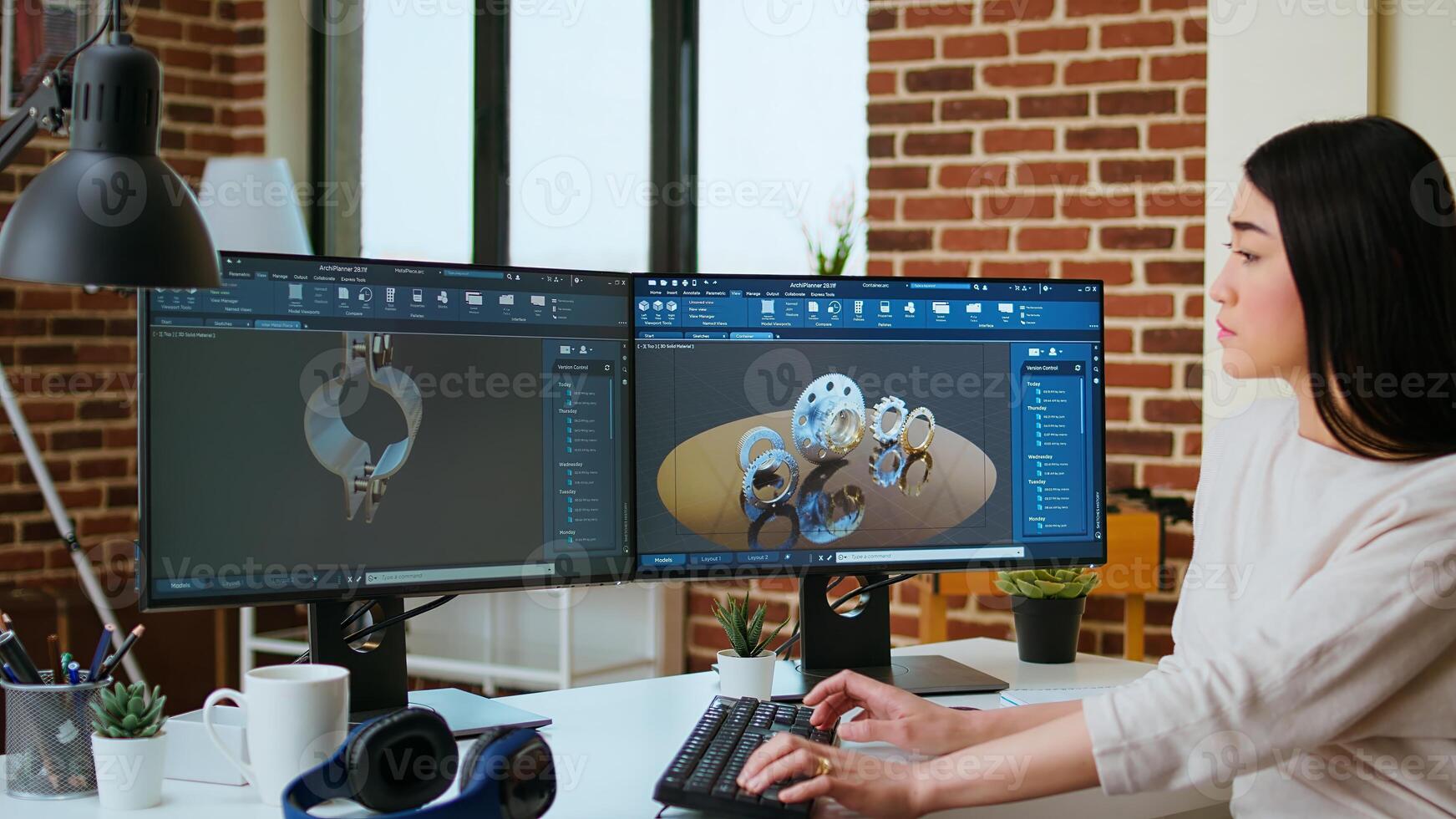 Expert engineer develops industrial prototypes using 3D modeling software at her home office, featuring dual monitors and modern office equipment perfect for innovative design processes. Camera A. photo