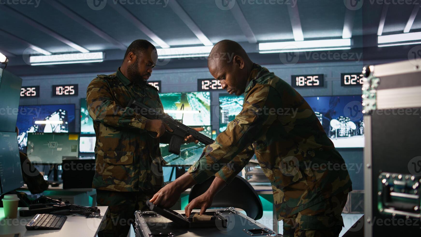 Military officers working together to check guns in command post, ensuring bullets and supplies are working properly. Team of soldiers holding pistol and rifles, managing combat load gear, camera B photo
