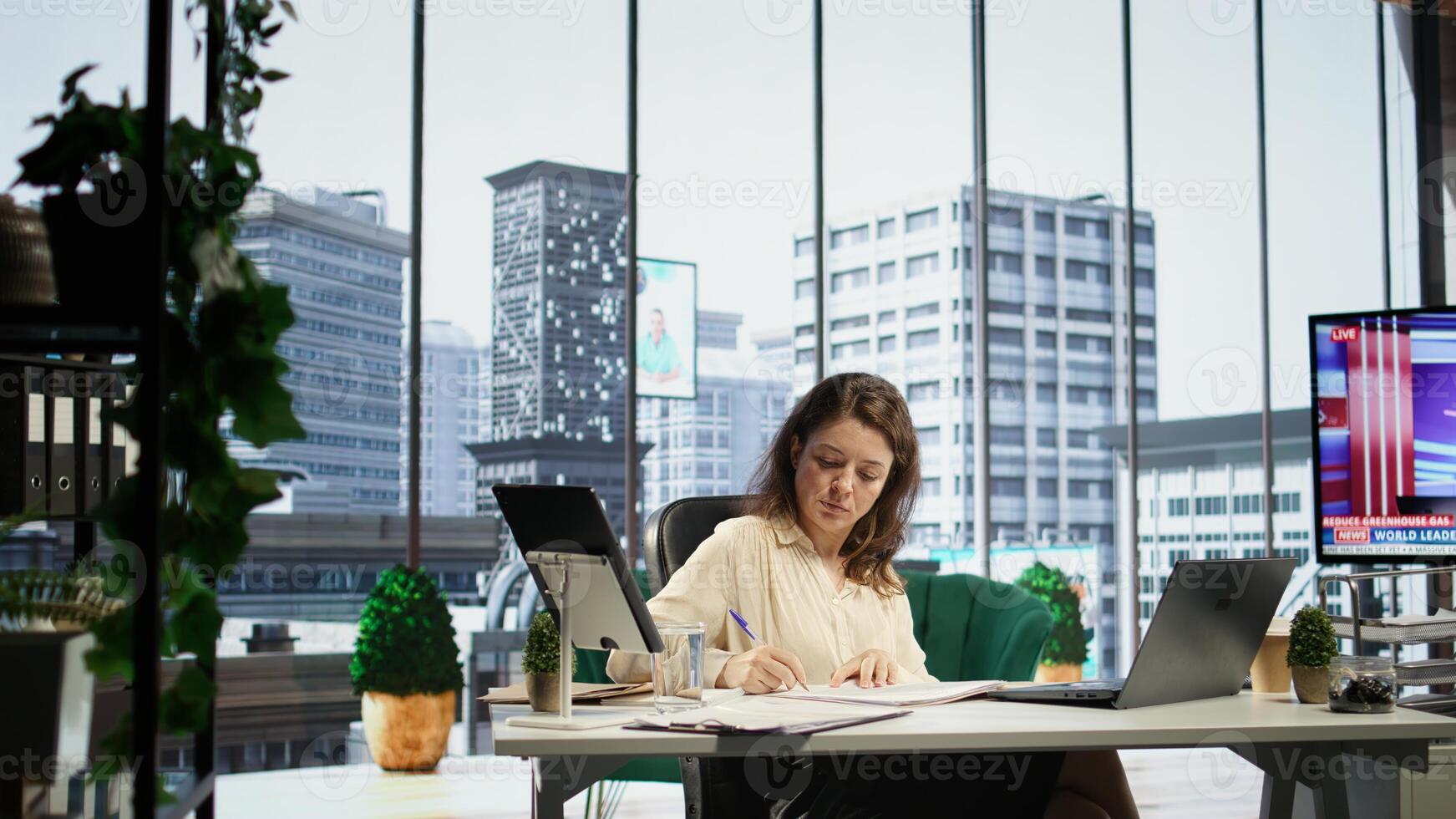 Enterprise director authorizing all work contracts and documents, signing paperwork as CEO with executive power. Solving all her legal obligations in high end office, leadership skills. Camera B. photo