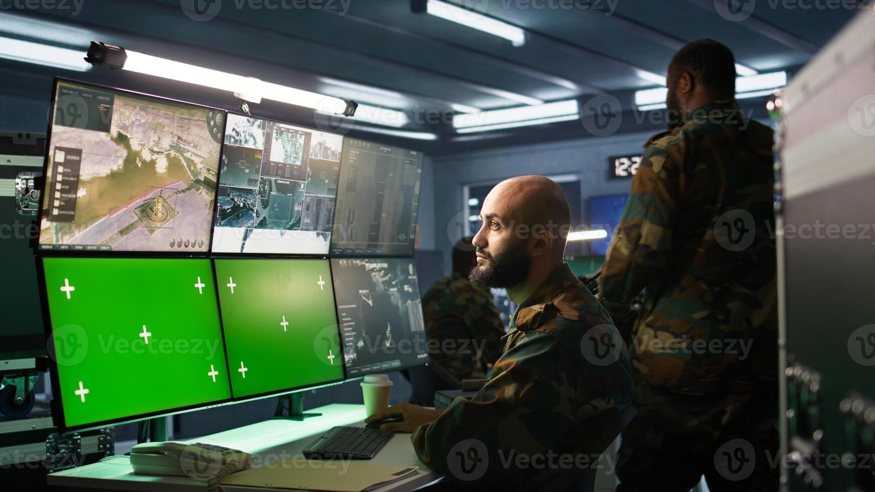 Military agent working in control room, using isolated screen software on laptop, analyzing aerial reconnaissance data. Intelligence corps expert controlling drones with mockup notebook, camera B photo