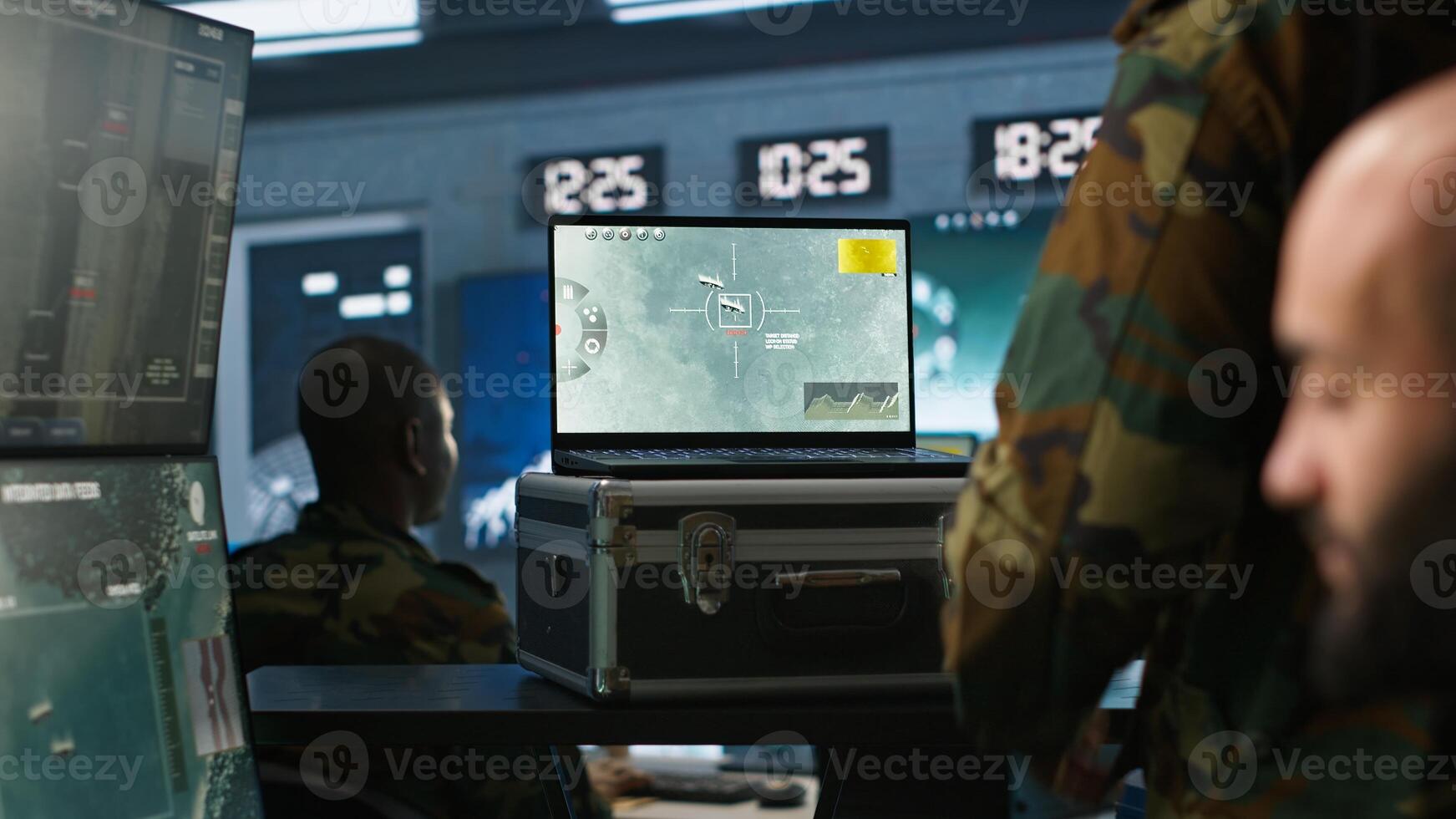 Air force combat control agent performing tactical level surveillance in war room using laptop. Military expert in base of operations using radar on notebook to look at assault zones, camera A photo