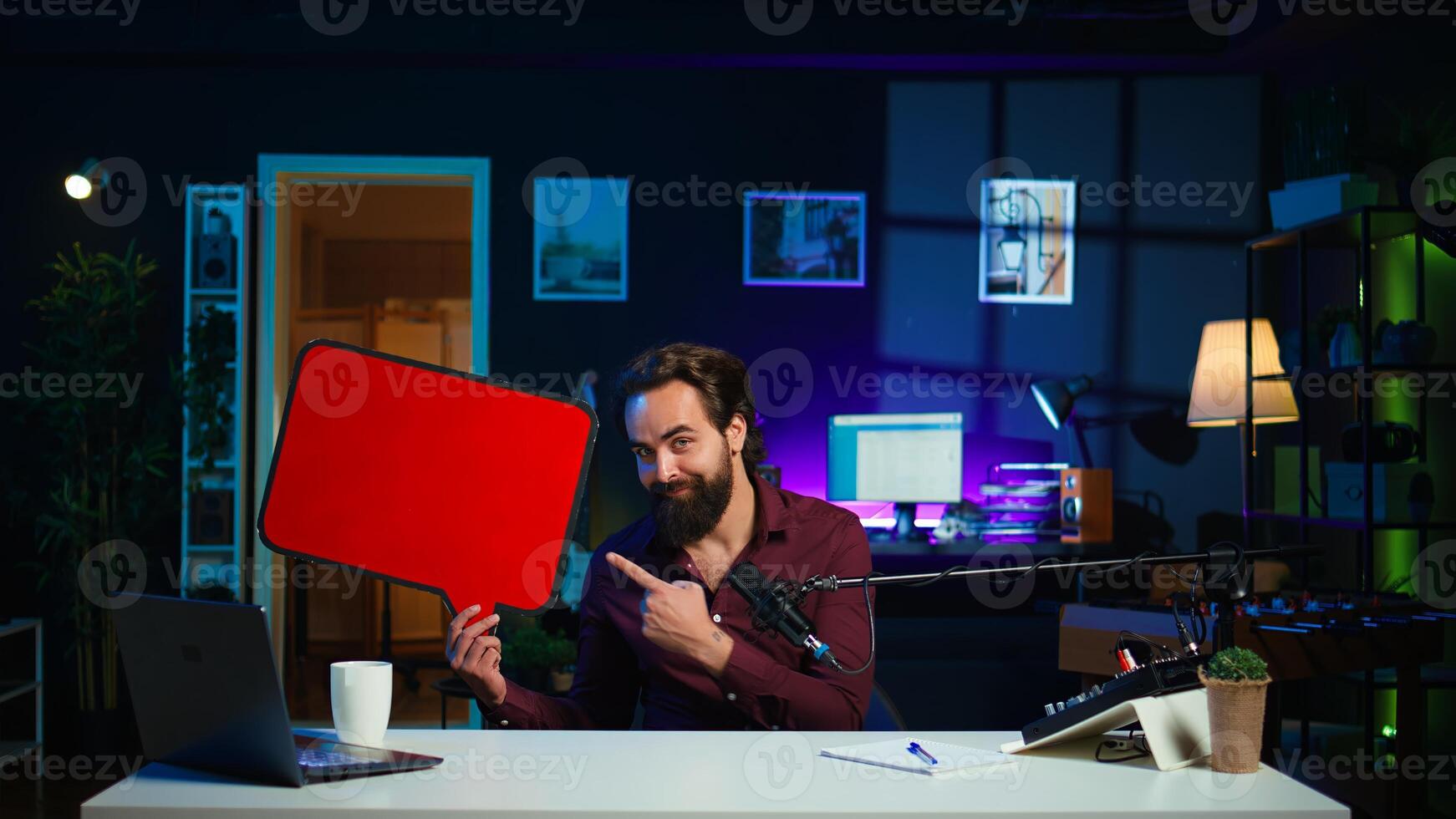 Influencer filming sponsored content, holding empty copy space sign, doing thumbs up sign. Internet star using cardboard bubble speech cutout to do promotion, doing positive gesturing, camera B photo