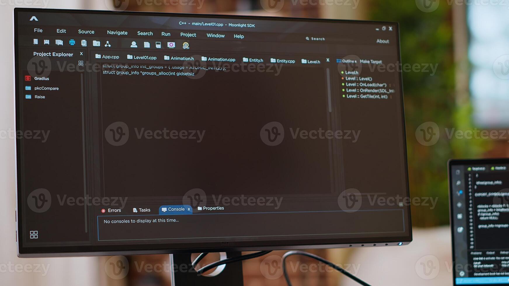 Asian programmer seen typing code for a user interface design on dual monitors, working in a digital workspace. Woman coder working on software engineering and front end development. Camera B. photo