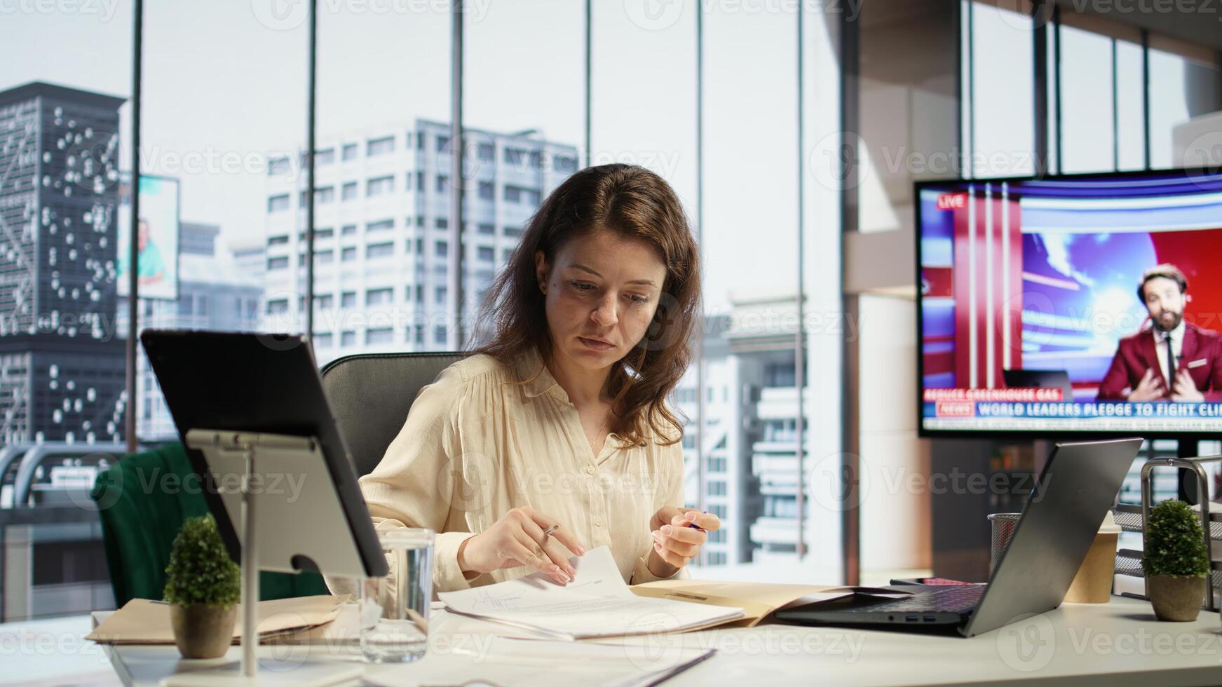 Female entrepreneur working on her legal obligations to sign paperwork and work contracts, approving all documents for performance and productivity. Businesswoman CEO gives authorizations. Camera B. photo