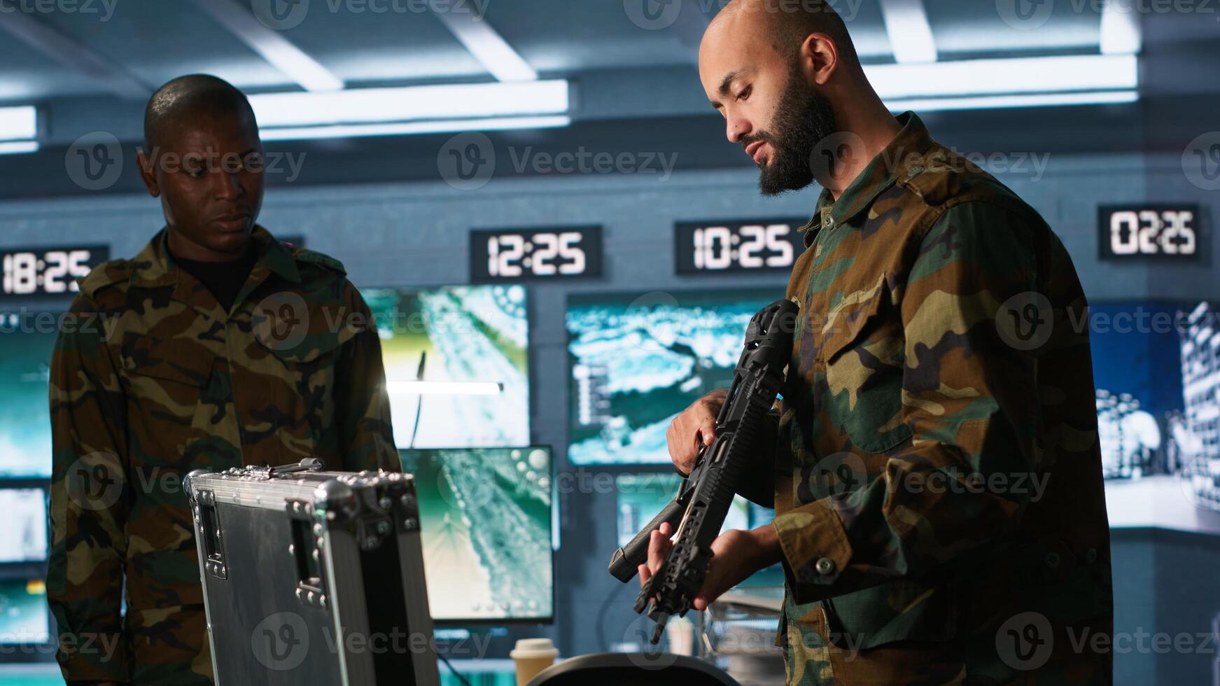 Army soldiers packing weapons able to engage targets at extended range with accurate, lethal fire. Military units loading guns with bullets, preparing for enemy suppression mission, camera A photo
