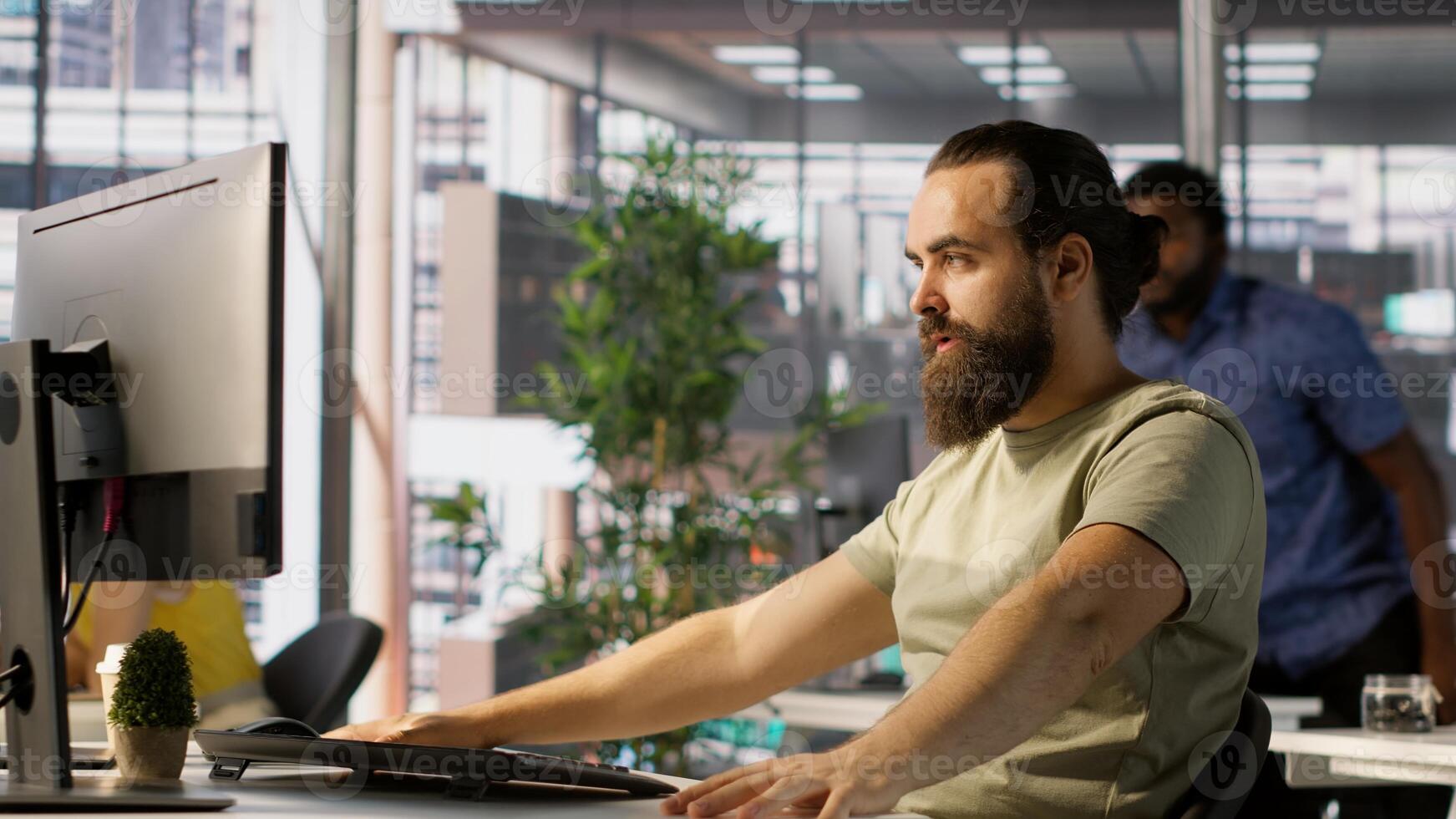 Annoyed programmer at work raging after losing all progress due to computer crash while creating machine learning models. Angry IT worker smashing desk in frustration while programming, camera A photo