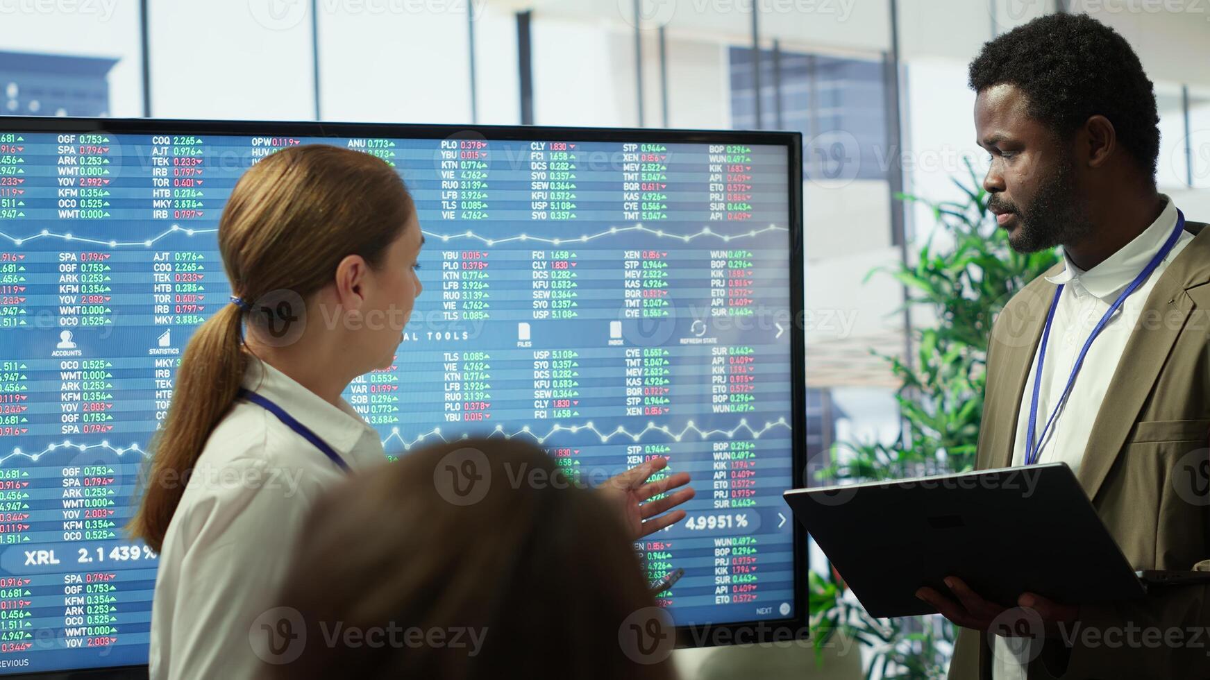Business associates sharing ideas in a corporate briefing meeting, utilizing interactive boards to present detailed project reports and align on key performance indicators and objectives. Camera A. photo