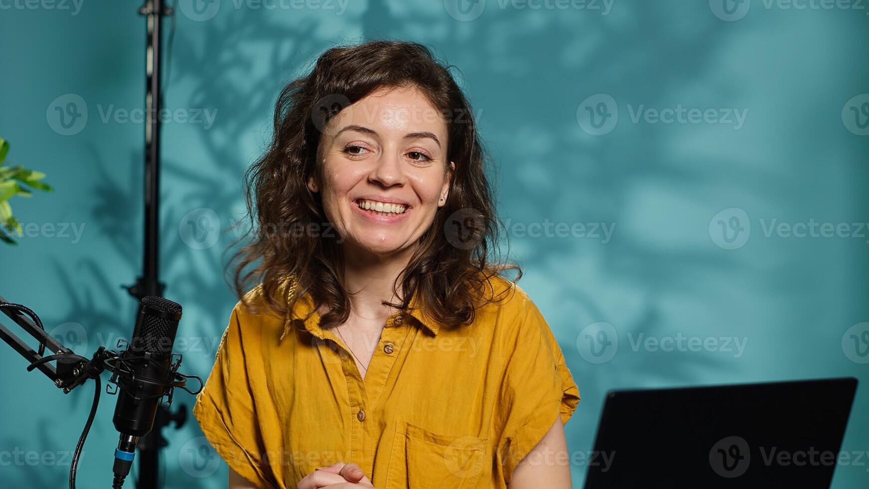 Content creator utilizes recording gear to shoot introductory segment for vlog channel, close up. Happy internet star welcomes devoted fan community, introducing today subject, camera A photo